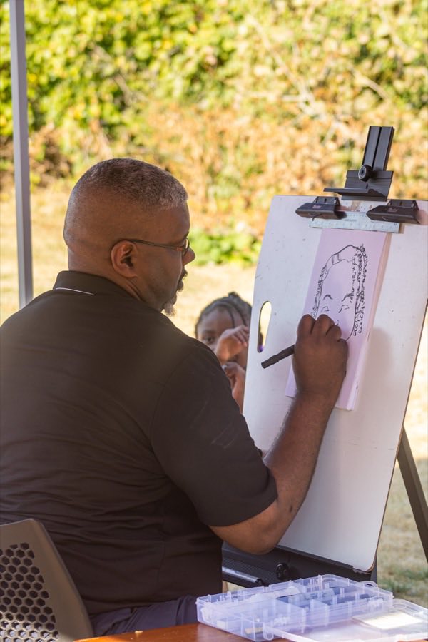 An artist at work at Kingdom Image Arts